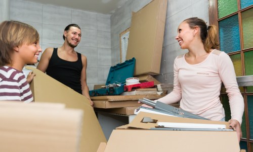 Moving house boxes and furniture in a Fulham residential street