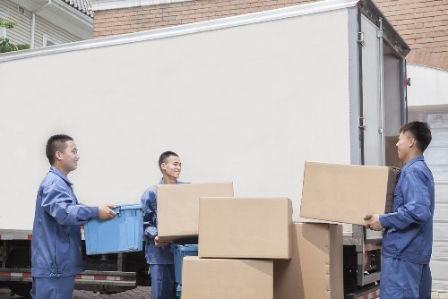 A local office move setup with labelled boxes and workspace items in Fulham