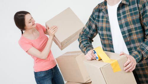 Removal van and moving boxes in a Fulham residential street