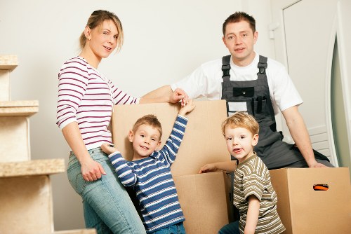Professional movers loading furniture into a van in Fulham