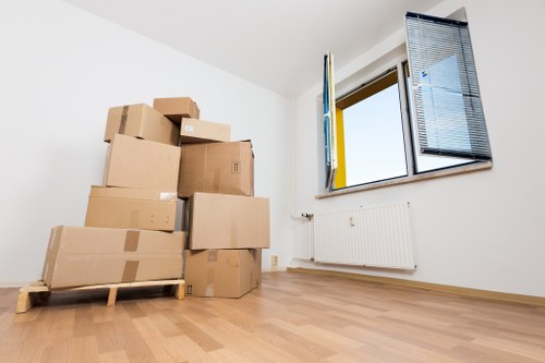 Packed office boxes and furniture ready for local relocation