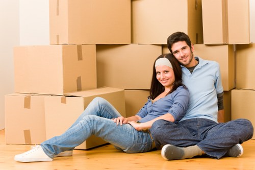Removal team handling boxed belongings in a Fulham apartment move