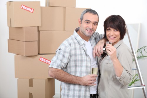 Professional movers handling furniture in a Fulham flat