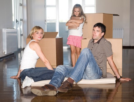 Local movers navigating stairs and narrow access in a Fulham property