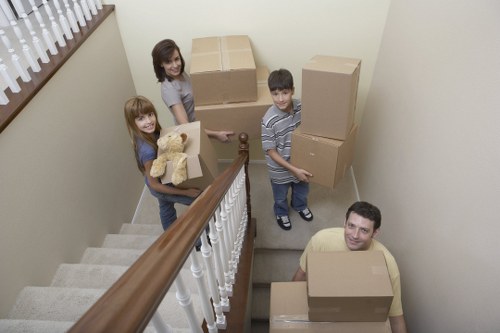 Furniture collection service handling stairs in a Fulham flat